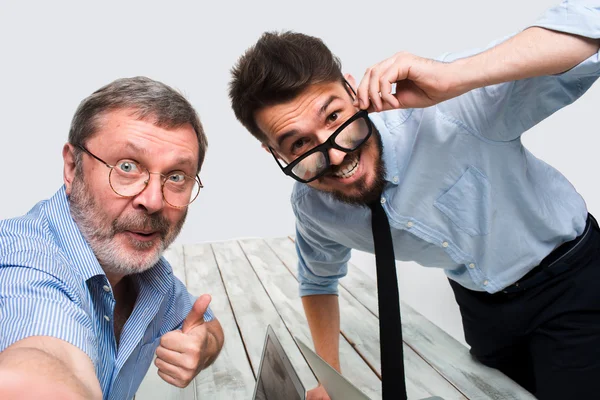 Two colleagues  taking the picture to them self sitting in  office — Stock Photo, Image