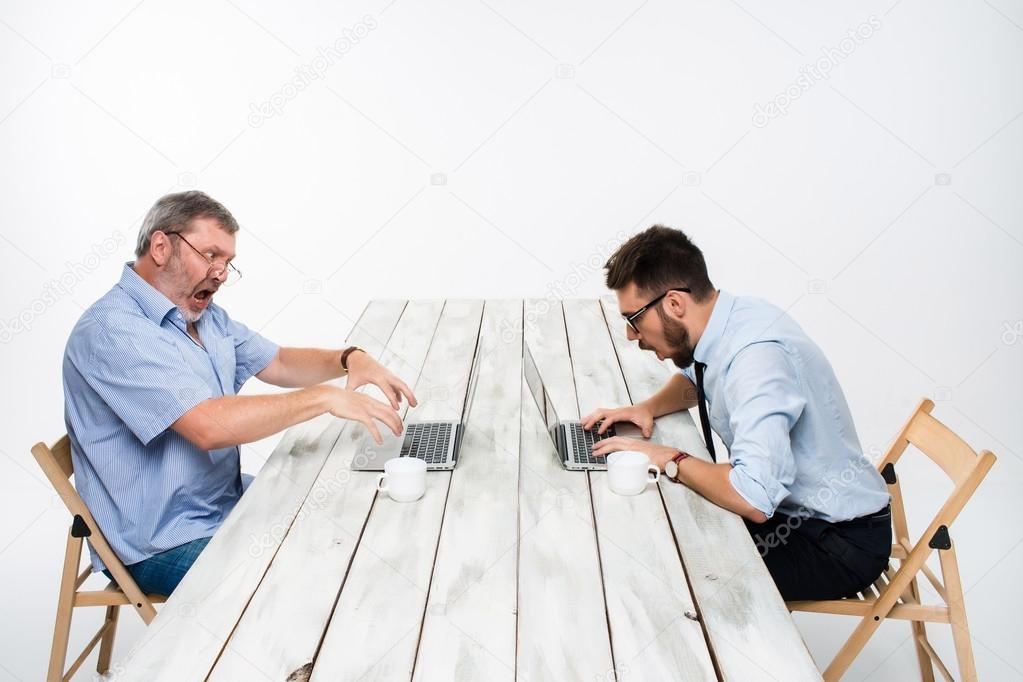 The two colleagues working together at office on white background