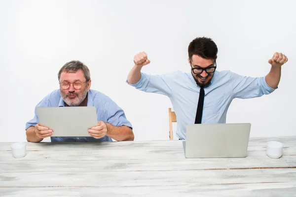 The two colleagues working together at office on white background — Stock Photo, Image