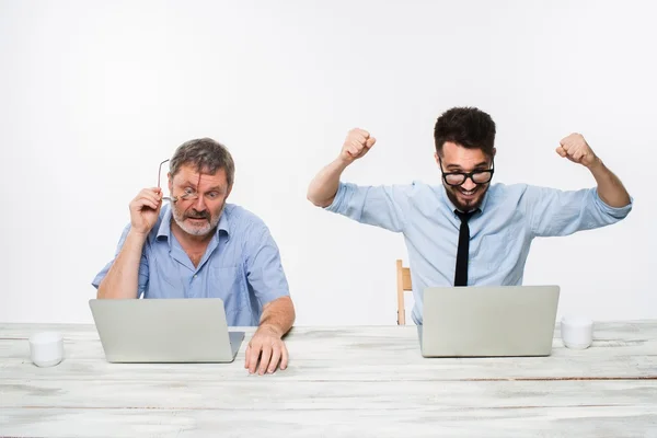 The two colleagues working together at office on white background — Stock Photo, Image