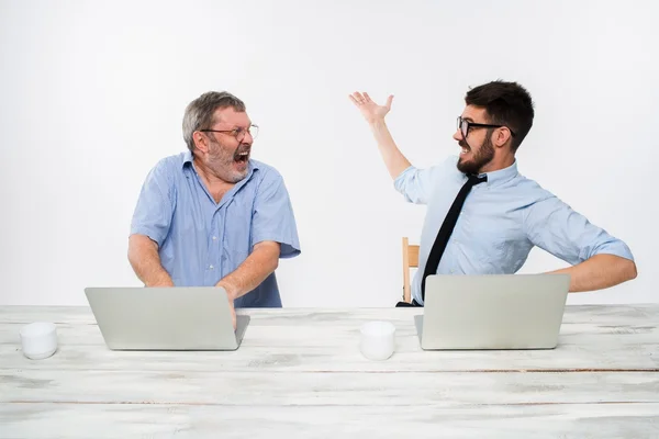 The two colleagues working together at office on white background — Stock Photo, Image