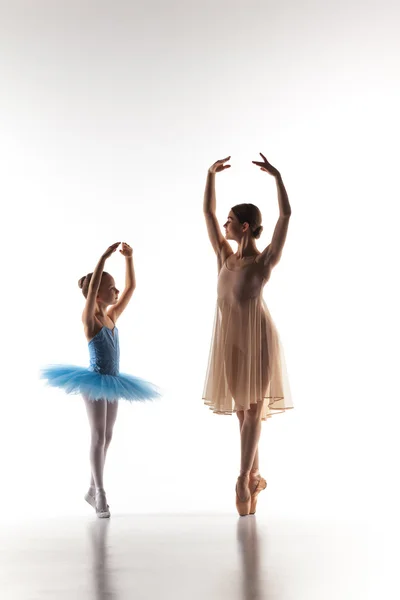 The little ballerina dancing with personal ballet teacher in dance studio — Stok fotoğraf