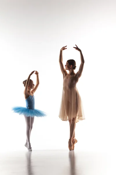 The little ballerina dancing with personal ballet teacher in dance studio — 图库照片