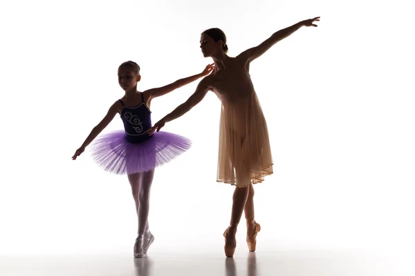 The little ballerina dancing with personal ballet teacher in dance studio — 图库照片