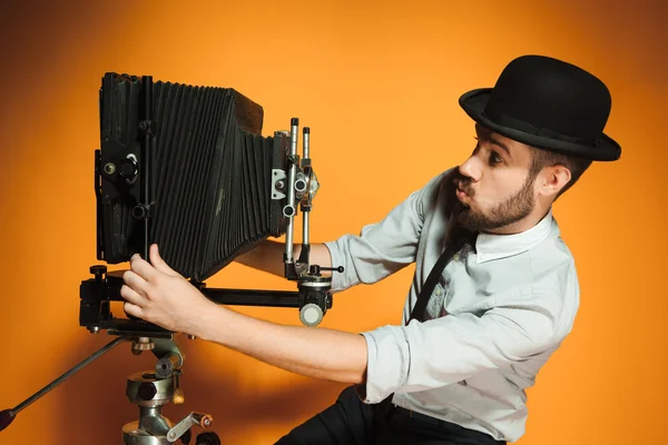 Young man with retro camera — Stock Photo, Image