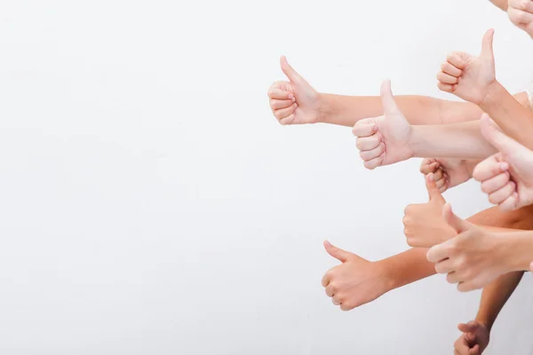 Hands of teenagers showing okay sign on white — Stock Photo, Image