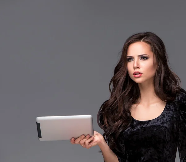 Sad woman using a tablet — Stock Photo, Image