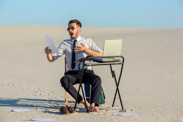 Businessman using  laptop in a desert — Stock Photo, Image