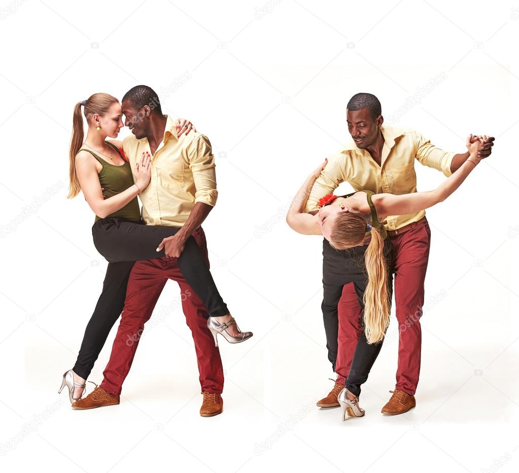 Young couple dances Caribbean Salsa, studio shot