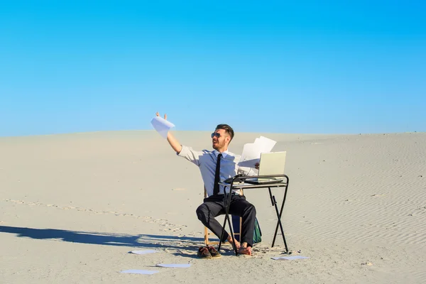 Businessman using  laptop in a desert — Stock Photo, Image