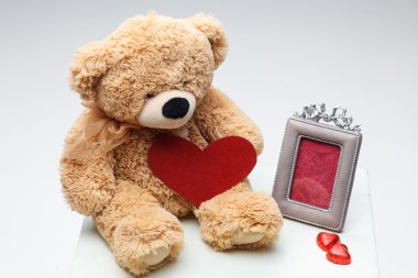 Teddy Bears couple with red heart. Valentines Day concept. clipart