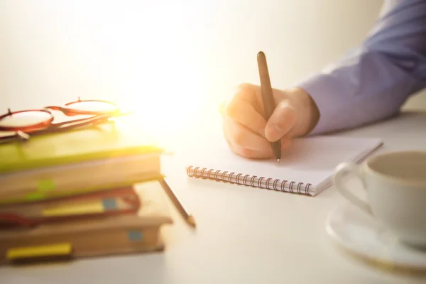 The male hand with a pen and the cup — Stock Photo, Image