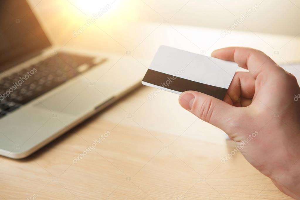 The man doing online shopping with credit card