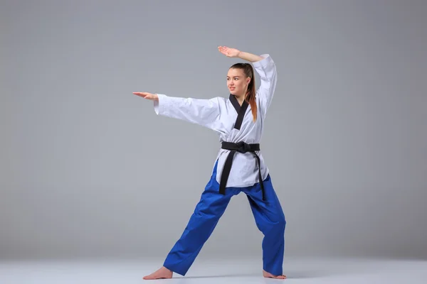 The karate girl with black belt — Stock Photo, Image