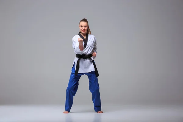 The karate girl with black belt — Stock Photo, Image