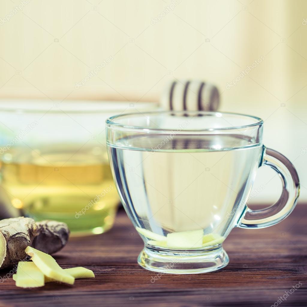 ginger  tea and honey on wooden table