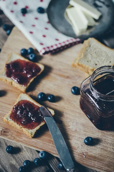 Toast bread with wild strawberry jam. Retro,vintage filter — Stock Photo, Image