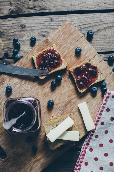 Toast bread with wild strawberry jam. Retro,vintage filter — Stock Photo, Image