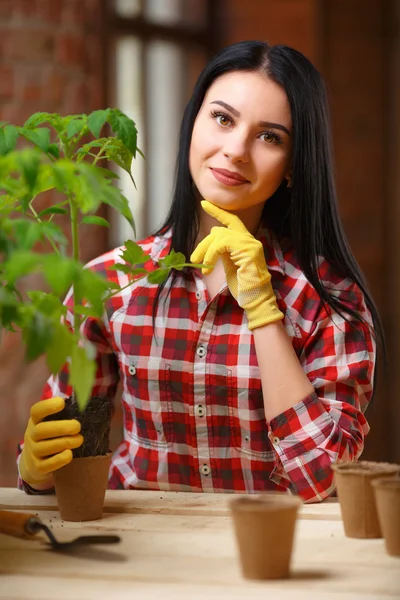 Charming young woman gardening — Stock Photo, Image