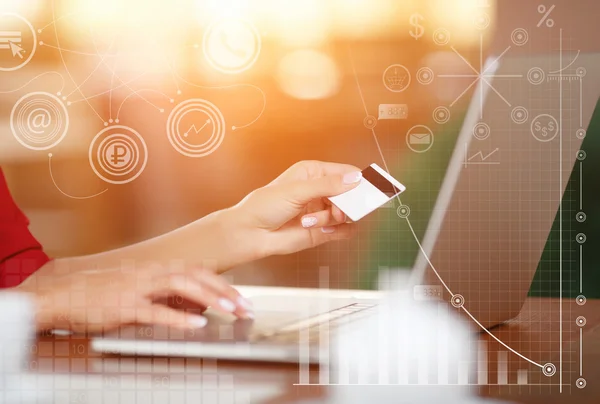 Hands holding credit card and using laptop — Stock Photo, Image