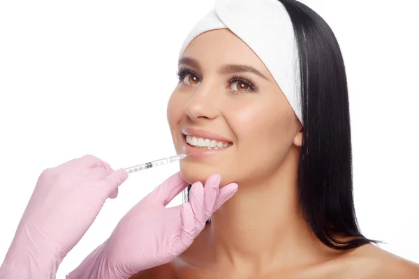 Young woman gets injection in her lips — Stock Photo, Image