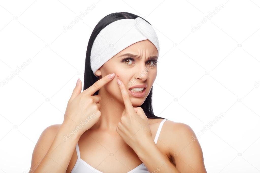 Shocked Woman Looking At Pimple On Forehead