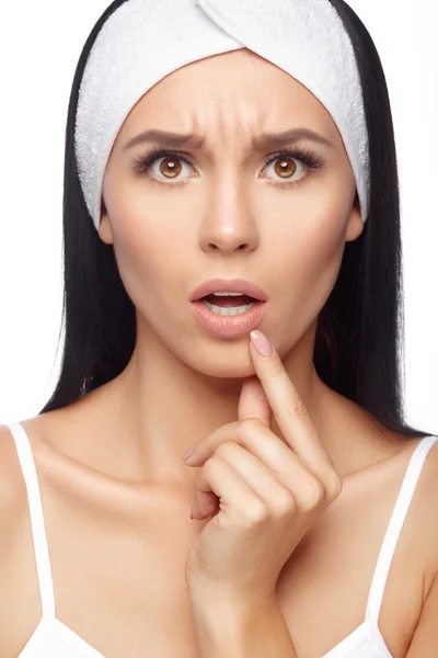 Shocked young woman touching her lips — Stock Photo, Image