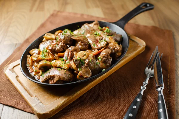 Liver baked with mushrooms, bacon and herbs — Stock Photo, Image