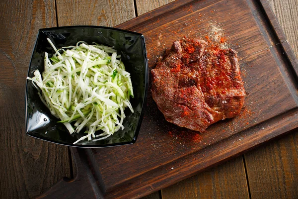 Delicious steak with red chili pepper — Stock Photo, Image