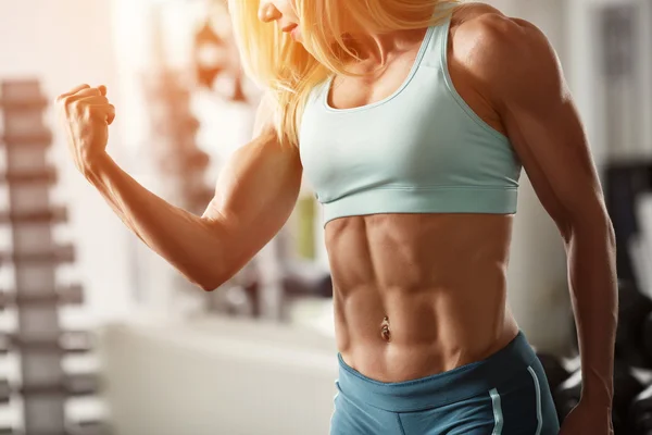 Brutal blond with a muscular, tanned body — Stock Photo, Image