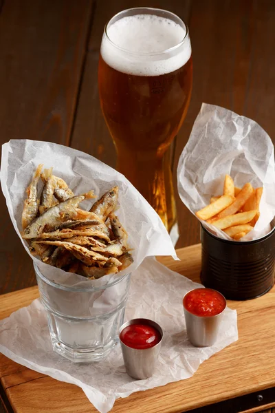 Sprat and french fries with gravy — Stock Image Sprat and french fries with gravy Stock Image