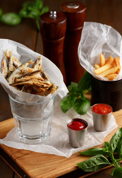 Sprat and french fries with gravy — Stock Image Sprat and french fries with gravy Stock Picture