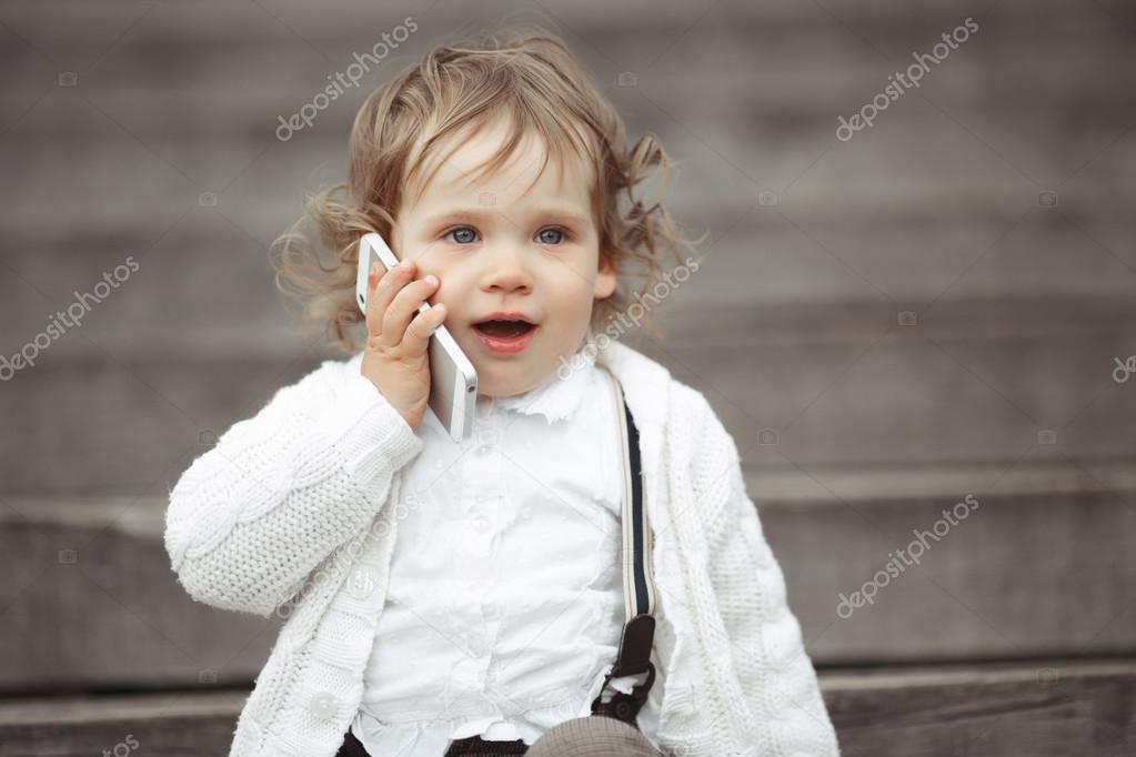 little girl talking on mobile phone