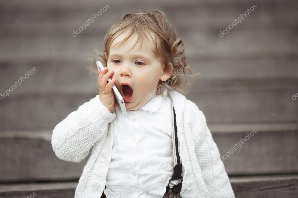 little girl talking on mobile phone