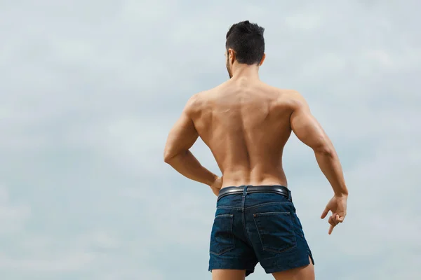 Muscular naked man from back — Stock Photo, Image