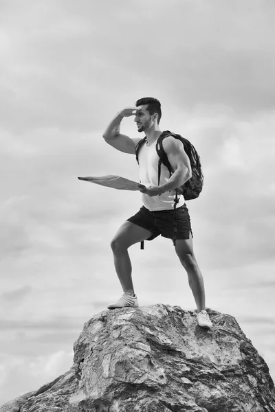 Black and white photo of a tourist with backpack — Stock Photo, Image