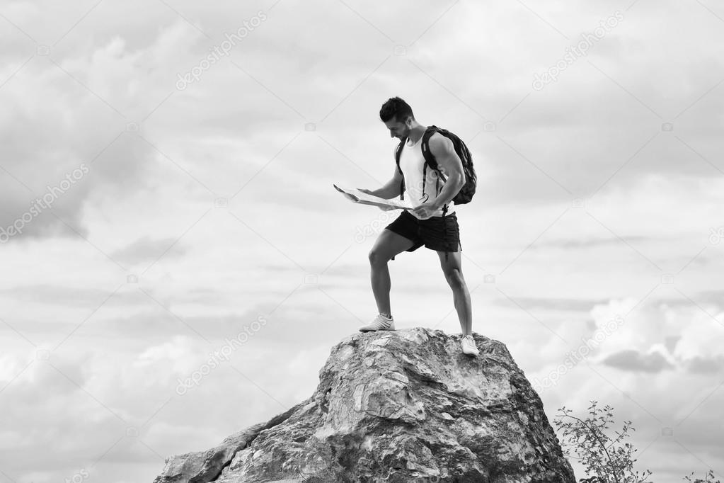Black and white photo of a tourist with backpack
