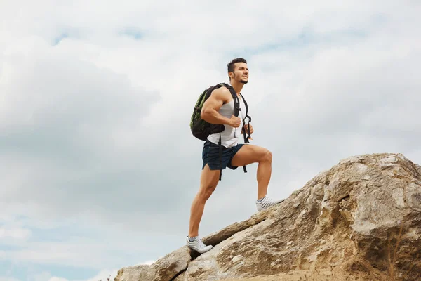 Young man tourist with a backpack — Stock Photo, Image