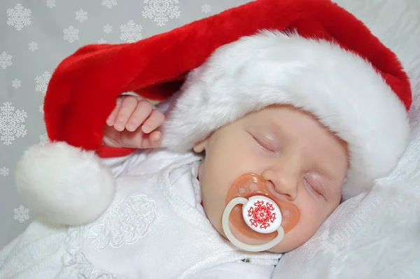 Sleeping christmas newborn baby in Santa Claus red hat. Photo for calendar, card — Stock Photo, Image