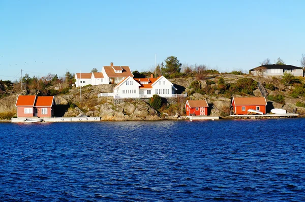 Wooden houses on the rocks — Stock Photo, Image