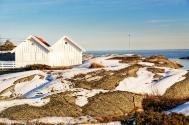 North Sea Coast with two white cottage clipart