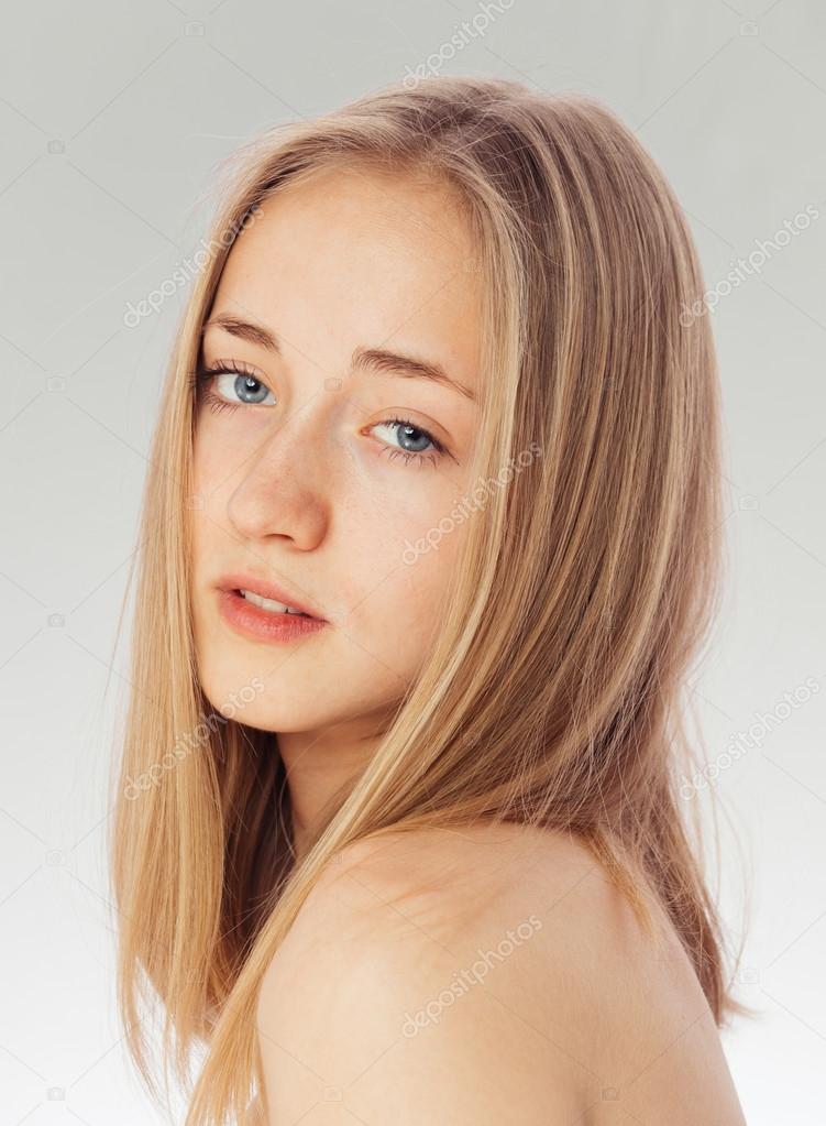 Beauty Portrait Of A White Girl With Clean Skin Blue Eyes And