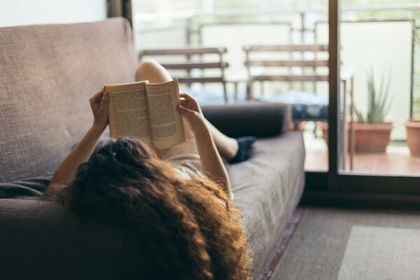 Young girl reading a book Stock Photo
