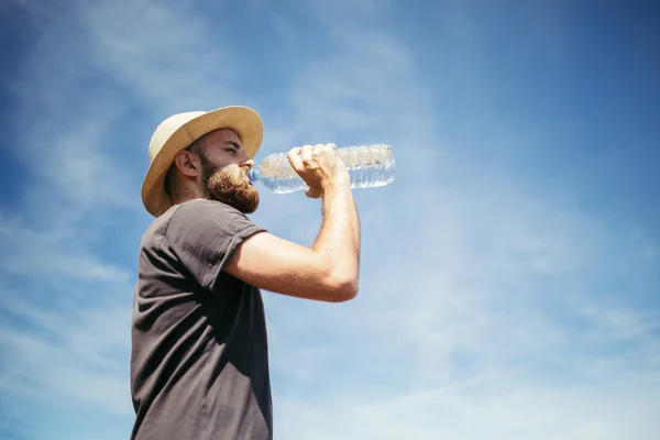 Man drinking water in nature Royalty Free Stock Photos