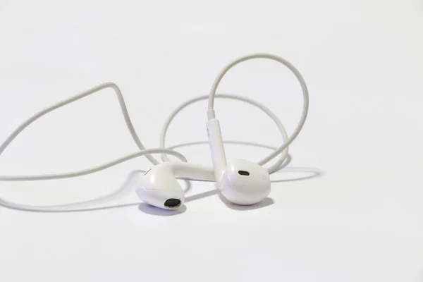 Earphones on the white background — Stock Photo, Image