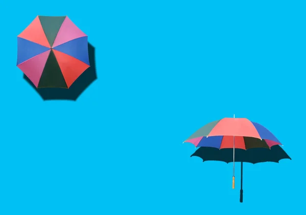 Top View Two Rainbow Umbrella Isolated Cyan Background Stock Photo — Stock Photo, Image