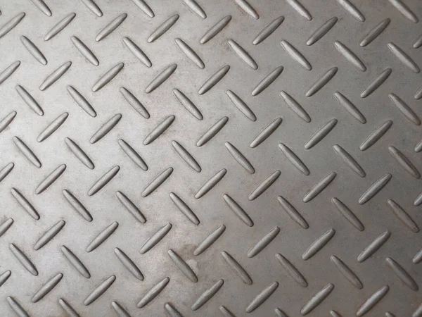 Stainless steel plate with  diamond pattern, silver metal floor texture surface for background or design, seamless texture metallic