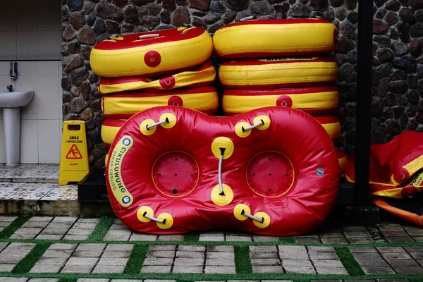 Inflatable boats are stored in layers, playing rafting