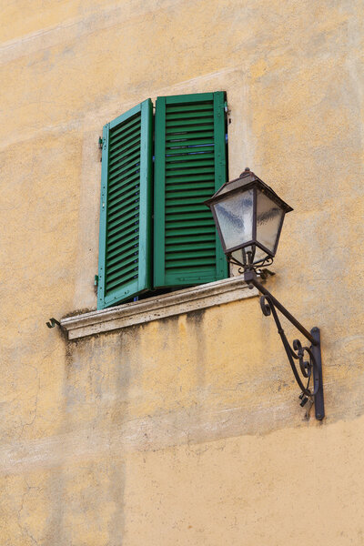 Wall with a lamp and window