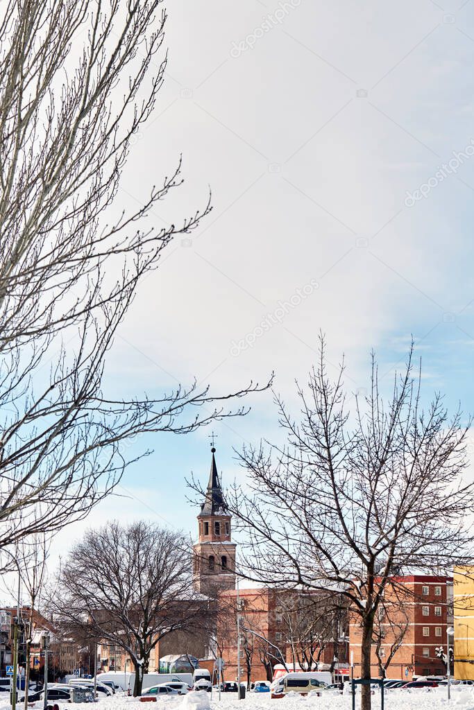 Snowy view of the Parroquia San Pedro Ad Vincula Madrid from Sie